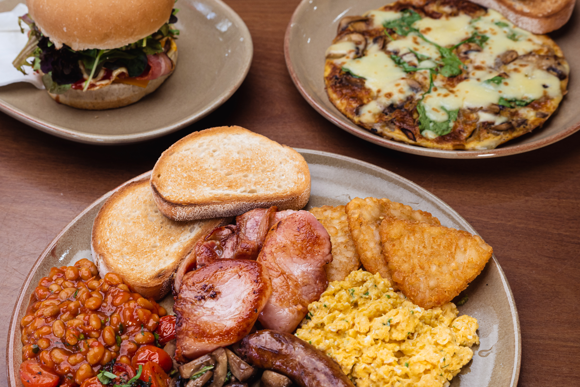 Big Italian breakfast spread with bacon, eggs and beans